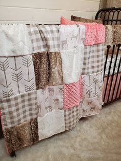 a baby crib with several blankets on it