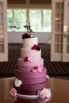 a multi layer cake sitting on top of a table