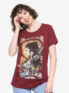 a woman wearing a star wars t - shirt holding a cell phone to her ear