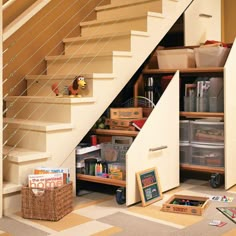 a room with some shelves and toys under the stairs