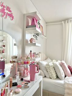 a room filled with lots of makeup and personal care items on top of a white table