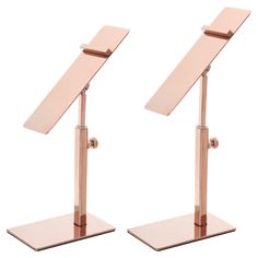 two metal desk top stands with one standing on the other