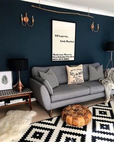 a living room filled with furniture and decor on top of a white carpeted floor