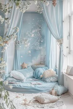 a bedroom with blue curtains and white flowers on the bed, in front of a window