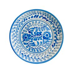 a blue and white plate with designs on it