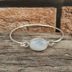 Welcome to my shop, Blue Fire Moonstone 925 Sterling Silver Bangle ,Open Adjustable Bangle ,Moonstone Jewelry ,Oval Shaped Moonstone Bangle ,Gift item. * Occasion : Anniversary, Engagement, Gift, Party, Wedding Stone Details * Stone Name: Moonstone  * Stone Colour : White  * Stone Shape : Oval  ♡ Thank You For Visiting :) White Moonstone Bangle, Minimalist Sterling Silver Oval Bracelets, Minimalist Sterling Silver Oval Bracelet, Minimalist Oval Sterling Silver Bracelets, Minimalist Oval Sterling Silver Bracelet, Minimalist Oval Bangle As A Gift, Minimalist Oval Bangle As Gift, Minimalist Oval Bangle Gift, Round Moonstone Bracelets For Gift