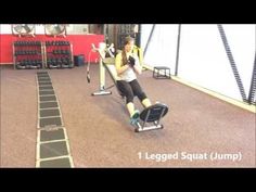 a woman is sitting on a bench in the gym