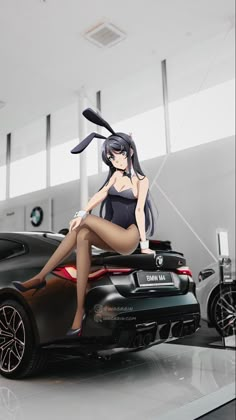 a woman sitting on top of a car in front of a black sports car with long hair