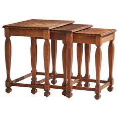 two wooden tables sitting next to each other