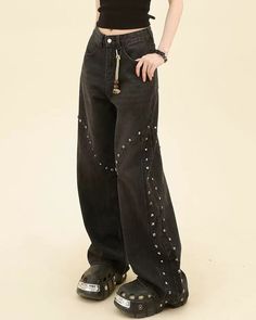 Grunge style black denim jeans with a high waist and wide legs, accented with rivet details for a unique and rebellious look Size: • S: Waist: 64cm/ 25.2 in, Hips: 100cm/ 39.4 in, Length: 106cm/ 41.7 in• M: Waist: 68cm/ 26.8 in, Hips: 104cm/ 40.9 in, Length: 108cm/ 42.5 in• L: Waist: 72cm/ 28.3 in, Hips: 108cm/ 42.5 in, Length: 110cm/ 40.6 in• XL: Waist: 76cm/ 29.9 in, Hips: 112cm/ 44.1 in, Length: 112cm/ 44.1 inMaterial: Denim Black High Waist Punk Jeans, Black Punk Mid-rise Jeans, Black Mid-rise Punk Jeans, Edgy Baggy High Waist Flare Jeans, Gothic Black Jeans For Streetwear, Black Y2k Jeans For Concert, Y2k Black Jeans For Concert, Edgy Wide Leg Flare Jeans, Edgy Black Baggy Flare Jeans