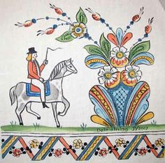 an embroidered wall hanging depicting two men on horseback