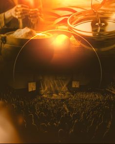 the sun shines brightly over an outdoor concert with speakers and people in the background