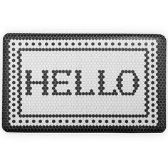 a black and white rug with the word hello written on it's front side