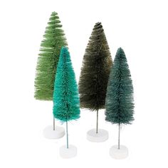 three small christmas trees in different colors and sizes