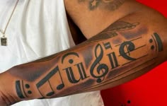 a man with music notes on his arm