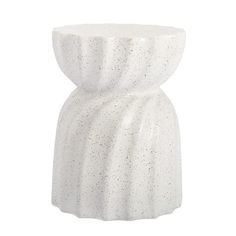 a white ceramic vase with small speckles on the top and bottom, sitting in front of a white background