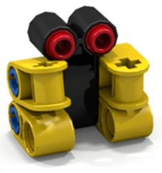 two yellow and one black plastic objects with red eyes on them, sitting next to each other