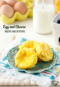 egg and cheese mini muffins on a blue plate with a glass of milk in the background