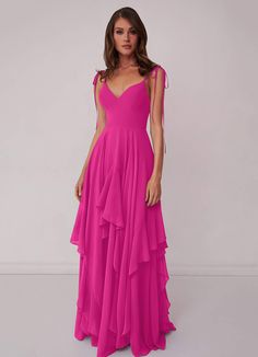 a woman in a long pink dress