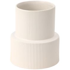 a white ribbed ceramic vase on a white background