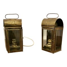 two old fashioned brass mail boxes with the letters vr and vf written on them