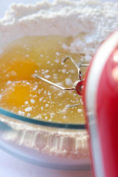 an egg is being made in a glass bowl