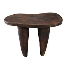 a small wooden table with two legs on it's sides and one foot in the middle