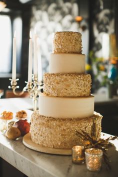 a three tiered cake sitting on top of a table