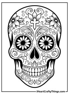 a black and white sugar skull with flowers on it