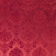 an image of a red wallpaper with intricate designs on it's surface, as well as the background