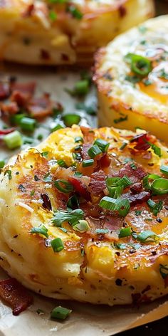 baked potatoes with bacon and green onions on a cutting board next to other food items