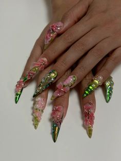 Nails created by (IG: @ninameulders)  The idea behind the nails (IG: @marianaazoch) For the base we use a nude glitter with an ombre of green chromes/ on the other nails a design woth bloominggel. And to top it off a bunch of hand sculpted 3d flowers and other 3d designs🫧🌸 Fake Nails Designs Acrylics Ideas, 3d Gem Nails, Long 3d Nails, Nail Clear Design, Nail Designs Pink And Green, Greek Acrylic Nails, Artsy Nail Ideas, Sculpted Nail Art, D&d Nails