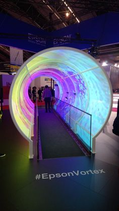 people are standing in front of an illuminated tunnel at the expo on oct 29, 2012