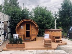 a wooden hot tub sitting on top of a patio