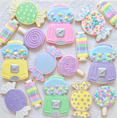 decorated cookies are arranged on a white doily