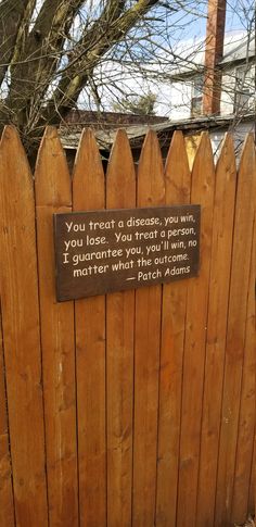 a wooden fence with a sign on it that says, you treat a directance