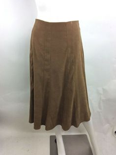 Dress Barn Vintage Women Skirt Light Brown Size 12 Description A-line skirt with extra flare at bottom Side zipper closure with belt holders (no belt) Light brown suede look/feel Fabric Content 97% Cotton   3% Spandex Measurements Length (waist to hem):  29 inches Waist (circumference): 33 inches Cheap Brown Lined Skirt, Cheap Brown Vintage Skirt, Vintage Brown Knee-length Skirt, Vintage Knee-length Brown Skirt, Retro Brown Skirt With Button Closure, Belt Holder, Measurement Length, Side Zipper, Brown Suede