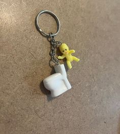 a keychain that has a small toy on it