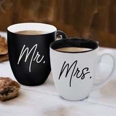 two coffee mugs with the words mr and mrs written on them next to cookies