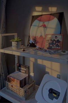 a shelf with various items on it in a room that appears to be used as a cd player