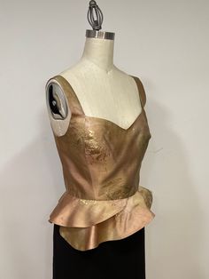 This blouse is a stunning piece made out of 100% Ombre silk in a wonderful rich pallet of beige tones and over the beige tones is sprinkled antique gold. It is lightweight and is fully lined. The blouse has princess seams and asymmetric peplum flared ham. Fastens in the back with small antique gold buttons.  The top gives a brilliance elegance and is prefect for evening, cockatiel and day time. Dimensions: Bust 36 inches Waist 29 inches Length from the shoulders to ham 22 inches Fits size medium Flared Blouse, Flare Blouse, Beige Tones, Evening Tops, Clothing Designs, Princess Seams, Princess Seam, Infinity Scarf, Silk Blouse