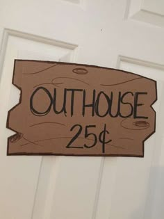 a sign that says outhouse 250 is hanging on the door