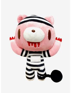 a pink stuffed animal with black and white stripes on it's face, holding a spatula