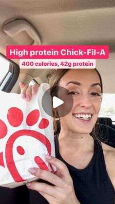 a woman holding a bag in her car with the caption high protein chick - fil - a