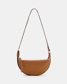 An essential shape - this is the Half Moon Crossbody Bag. Crafted from leather and shaped to a compact crescent silhouette with plenty of space on the inside. It's finished with an adjustable strap that makes it super easy to wear.  Zip closure Adjustable strap Metal hardware Two interior pockets Will fit the largest size iPhone - please check measurements Allsaints Shoulder Bag With Removable Pouch For Everyday, Allsaints Chic Shoulder Bag With Adjustable Strap, Chic Allsaints Shoulder Bag With Adjustable Strap, Modern Allsaints Crossbody Shoulder Bag, Allsaints Shoulder Bag With Adjustable Strap For Everyday, Allsaints Casual Shoulder Bag With Adjustable Strap, Half Moon Bag Outfit, Boots And Sneakers, Sneaker Heels