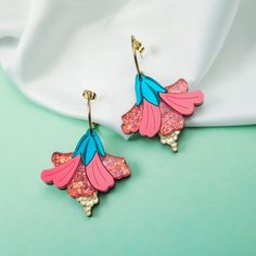 These colorful hibiscus flower earrings will turn you into a striking tropical beauty :) They are made of laser cut acrylic glass and wood. Each pair is carefully handcrafted to achieve perfection. The size of the flower is 4x4cm and it hangs on an open golden hoop with a diameter of 2cm made of jewelry metal (not suitable for allergy sufferers). Acrylic Earrings Laser Cut, Laser Cut Jewelry Acrylic, Three Color Combinations, Tropical Beauty, Laser Cut Jewelry, Acrylic Jewelry, Light Weight Jewelry, Jewelry Metal, Laser Cut Acrylic