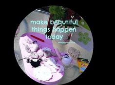 there is a pink tray with crochet items on it that says make beautiful things happen today