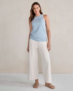 This organically grown cotton tank is a soothing staple for everyday ease. You'll love the sporty racerback, textured rib knit, and versatile vibe. (Hint: You'll want it in every color.) Details + Design: Sleeveless. Racerback. Hits slightly above hip. 24" length. Material: 92% Organically Grown Cotton, 8% SpandexCare: Machine Wash; Tumble Dry Imported | Essential Organic Cotton Racerback Tank Top Haven Well Within Chic Sleeveless Activewear For Spring, Versatile Ribbed Activewear For Loungewear, Casual Ribbed Racerback Activewear, Solid Color Athleisure Tank Top For Loungewear, Solid Athleisure Tank Top For Loungewear, Versatile Everyday Tank Activewear, Athleisure Tank Top For Loungewear, Versatile Ribbed Yoga Tops, Versatile Tank Top