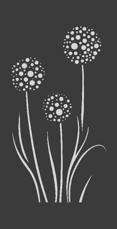 three dandelions on a black background with white dots in the center and bottom