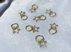 Perfect for adding a twinkle to your hairstyle. Dainty, classy, subtle and beautiful star hair charms. Perfect for both large and small braids, buns, and other up-dos. Your choice of 5 pc or 10 pc set.  Care instructions: Remove before showering. To put on, gently twist the ends away from each other, loop around hair, gently twist back into place, and enjoy! Braid Rings, Hair Charms, Loc Jewelry, Small Braids, Braided Ring, Star Hair, Hair Rings, Gold Star, Accessories Hair